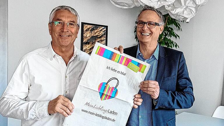 „Mein Lieblingsladen“ - (sg) „Eine klasse Idee“, sagt Werner Christoffel (links), Vorsitzender der Werbegemeinschaft „Schweinfurt erleben“ zur Aktion „Mein Lieblingsladen“ der Mediengruppe Main-Post, hier vertreten von Anzeigenleiter Peter Kruse. Den Handel vor Ort zu stärken ist ein Ziel der Aktion, die eine Weiterentwicklung von „Lass den Klick in Deiner Stadt“ ist. Die Aktion schlägt die Brücke zwischen Offline- und Online-Handel. Die Werbegemeinschaft „Schweinfurt erleben“ übernimmt für ihre Mitglieder 50 Prozent der Kosten. Neugierig, was der Lieblingsladen alles hat? Dann gleich mal hier reinschauen: www.mein.lieblingsladen.de „Mein Lieblingsladen“ - (sg) „Eine klasse Idee“, sagt Werner Christoffel (links), Vorsitzender der Werbegemeinschaft „Schweinfurt erleben“ zur Aktion „Mein Lieblingsladen“ der Mediengruppe Main-Post, hier vertreten von Anzeigenleiter Peter Kruse. Den Handel vor Ort zu stärken ist ein Ziel der Aktion, die eine Weiterentwicklung von „Lass den Klick in Deiner Stadt“ ist. Die Aktion schlägt die Brücke zwischen Offline- und Online-Handel. Die Werbegemeinschaft „Schweinfurt erleben“ übernimmt für ihre Mitglieder 50 Prozent der Kosten. Neugierig, was der Lieblingsladen alles hat? Dann gleich mal hier reinschauen: www.mein.lieblingsladen.de