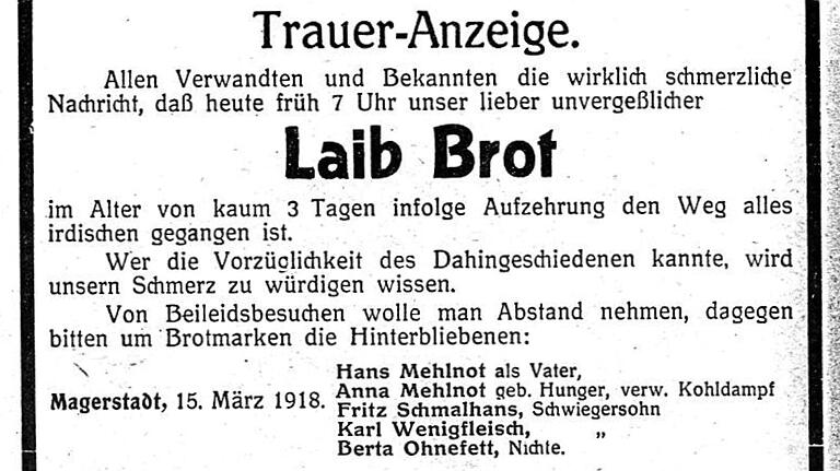 Versorgungsengpässe auf sakastische Weise gesehen: Eine Postkarte mit der Traueranzeige für einen Laib Brot.&nbsp;