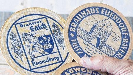 Drei Bierdeckel als Zeugen vergangener Brauereikunst: Hammelburg (1930), Poppenlauer (1943) und Euerdorf (1965).