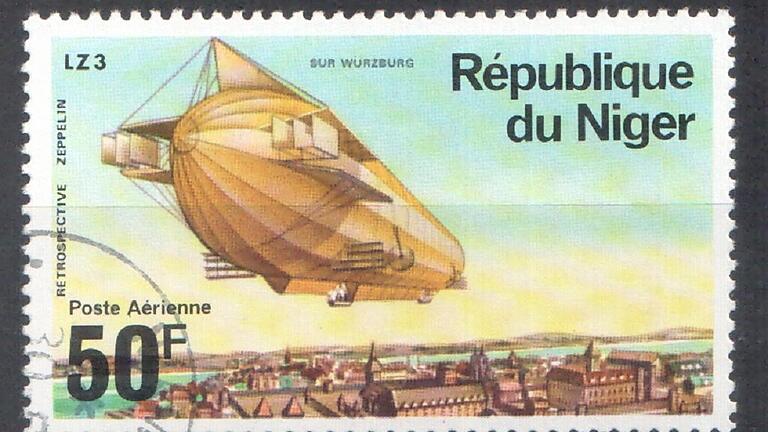 Würzburger Kulisse auf einer Briefmarke der Republik Niger       -  Sammler Günther Klebes aus Erlangen hat auf einer Briefmarke der Republik Niger einen Zeppelin über der Würzburger Stadt schwebend entdeckt. Diese Marke ist eine von fünfen eines Satzes, der 1976 erschienen ist und verschiedene Luftschiffe über verschiedenen Städten Deutschlands zeigt. Klebes ersteigerte den Briefmarkensatz bei einer luxemburgischen Internetauktion. LZ 3 war das dritte Experiment-Schiff von Ferdinand Graf von Zeppelin. Es wurde 1906 gebaut. Im Jahr 1908 wurde es an das Deutsche Heer verkauft und als Schulschiff eingesetzt. Kurz vor Ausbruch des I. Weltkrieges wurde es abgerüstet. Warum der Designer der Marke die Stadt und nicht Festung Marienberg oder Käppele als Kulisse wählte, ist dem Sammler schleierhaft. Foto: Sammlung Günther Klebes