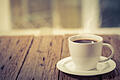 Coffee hot cup       -  Coffee cup on a day window background