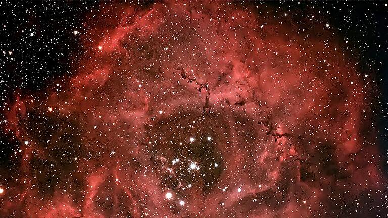Der Rosettennebel im Sternbild Einhorn: Es handelt sich um einen diffusen Emissionsnebel, sprich um interstellare Gaswolken, die selbst Licht aussenden, mit einem offenen Sternhaufen. Der Rosettennebel im Sternbild Einhorn: Es handelt sich um einen diffusen Emissionsnebel, sprich um interstellare Gaswolken, die selbst Licht aussenden, mit einem offenen Sternhaufen.