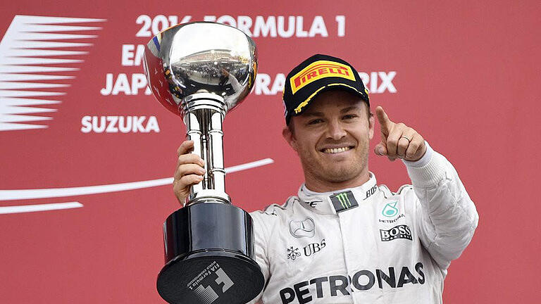 Sieg - Nico Rosberg jubelt über seinen Sieg beim Großen Preis von Japan. Foto: Franck Robichon Sieg - Nico Rosberg jubelt über seinen Sieg beim Großen Preis von Japan. Foto: Franck Robichon