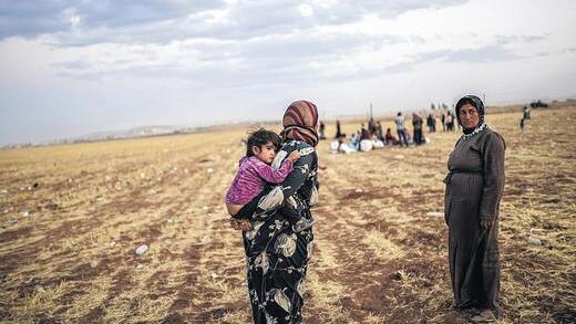 Flucht vor dem IS-Terror: Syrische Kurden an der Grenze zur Türkei.