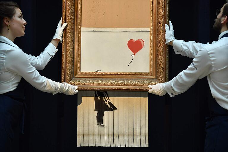 'Girl With Balloon' zur Hälfte in Streifen geschreddert.