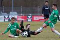 Auf dem Hosenboden gelandet ist in dieser Szene Paul Karle (Mitte) vom TSV Karlburg nach dem Zweikampf mit Maximilian Berg (links) und Mario Baldauf vom SV Fortuna Regensburg. Seine Mannschaft verlor das erste Bayernliga-Spiel nach der Winterpause mit 0:2.
