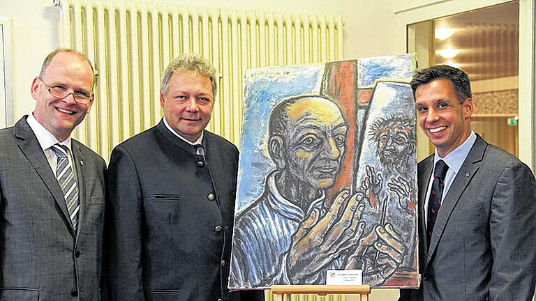 Beim Selbstporträt von Walter Habdank: v.l. Dekan Oliver Bruckmann, Sohn Johannes Habdank, Augustinum-Direktor Marcus Reuter.