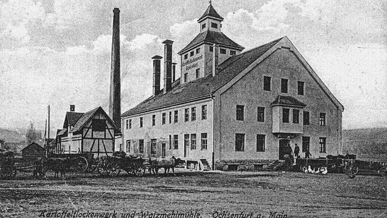 Dieses Postkarte zeigt das Flockenwerk in seinen Anfangszeiten um 1920. Das Bild wurde veröffentlicht in der Reihe &bdquo;Archivbilder Ochsenfurt&ldquo;, erschienen im Sutton-Verlag, 2006. Das Büchlein wurde herausgegeben von Volkmar Halbleib und Heinz Kretzer.