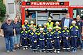 Die neuen stolzen Floriansjünger der Großgemeinde Röthlein nach der bestandenen Prüfung zur Kinderflamme in Hirschfeld mit ihren Ausbildern und Bürgermeister Peter Gehring.