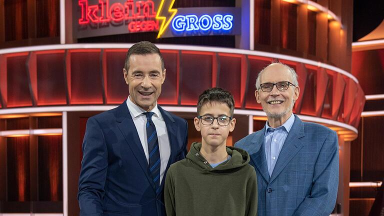 Robin aus Kist ist bei der TV-Show 'Klein gegen Groß' dabei. Von links: Moderator Kai Pflaume, Robin aus Kist und Herausforderer Dr. Thomas Kinne.